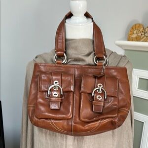 Coach SoHo British Tan Satchel

Width: 13”
Height: 9”